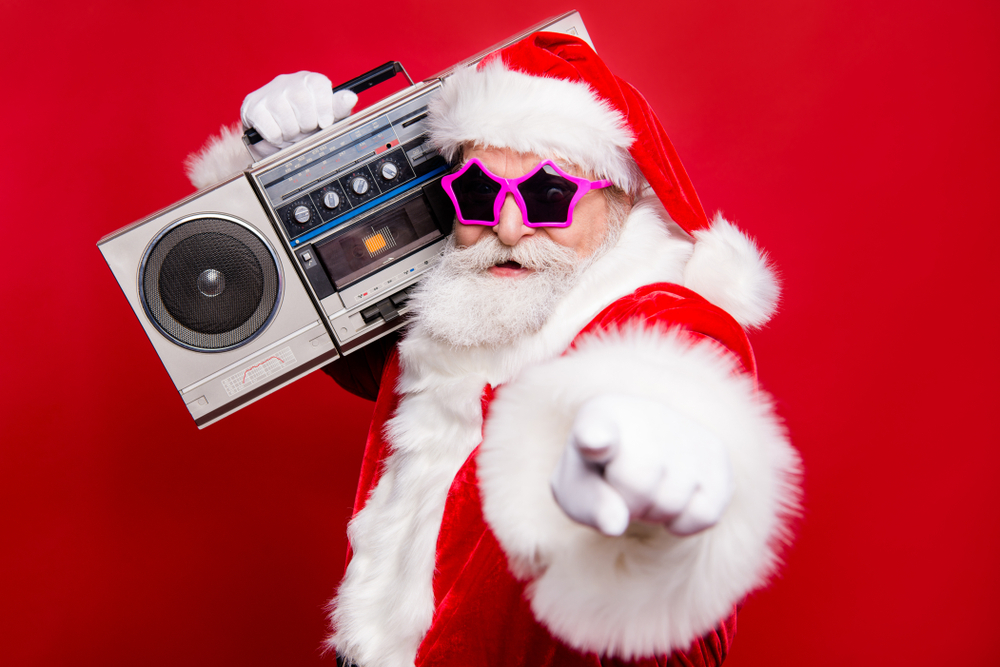 An image of Santa Claus holding a radio to his shoulder and pointing
        at the screen