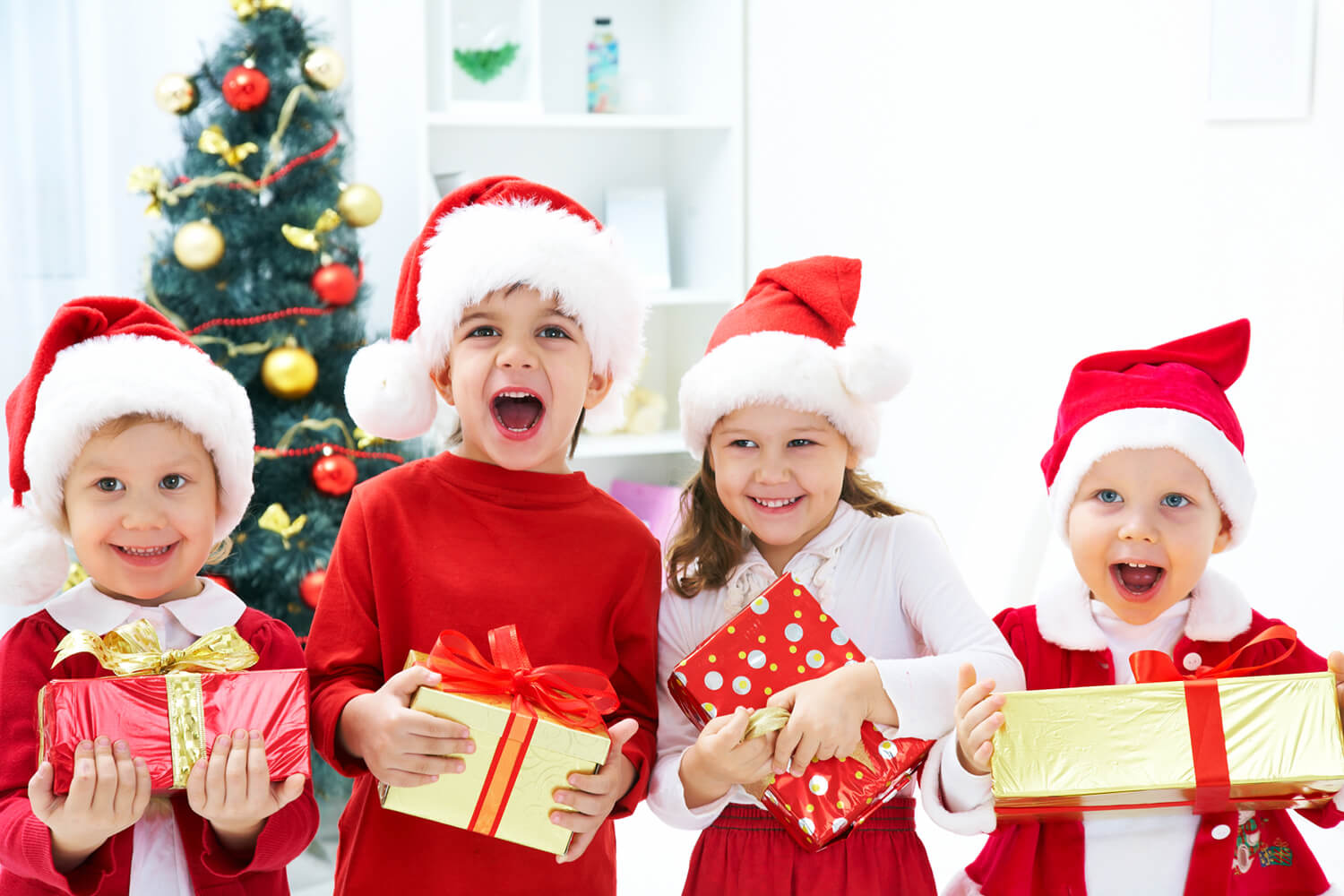 An image of children holding gifts